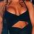 Trish's torso in a skimpy black dress.